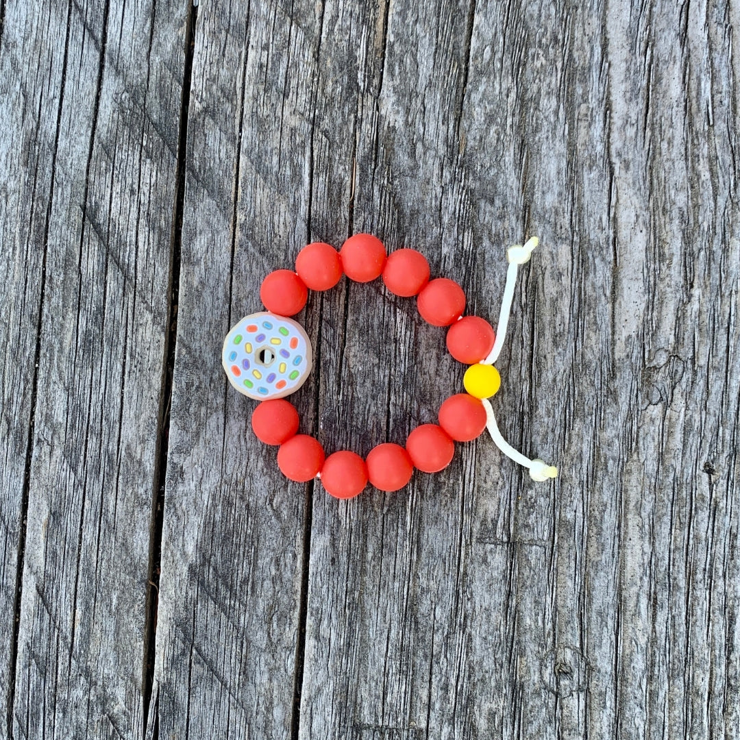 ChewBling Sensory adjustable DONUT chew bracelet - Vanilla Confetti with orange 8mm silicone beads