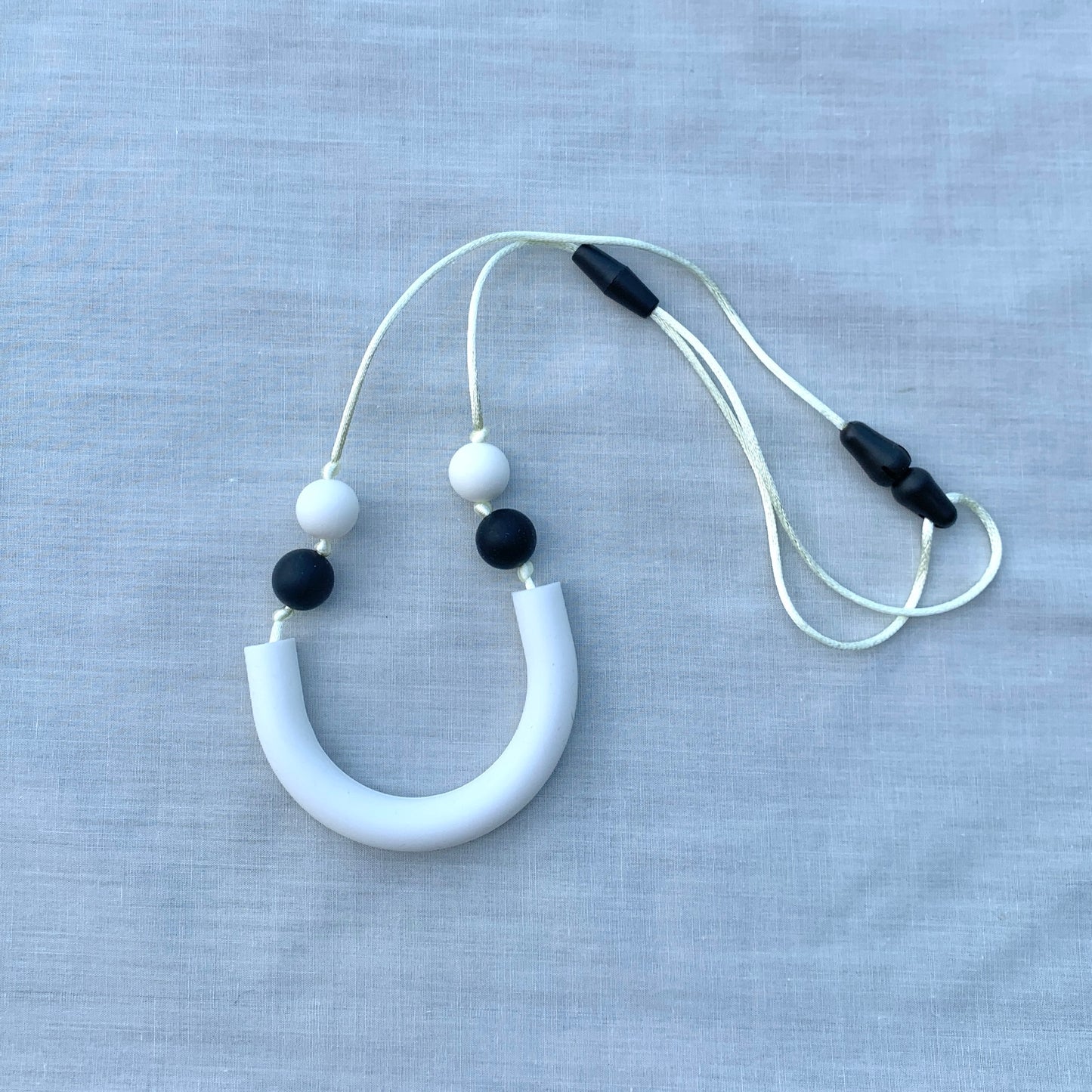 ChewBling Sensory White curved TUBE chew necklace is designed for sensory seekers, autism, anxiety, ADHD and oral motor needs.